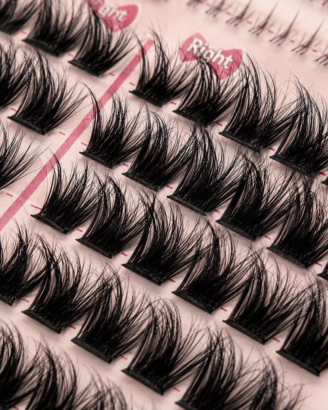 Close-up of wispy DIY lash clusters showing lash fibers and cluster bases